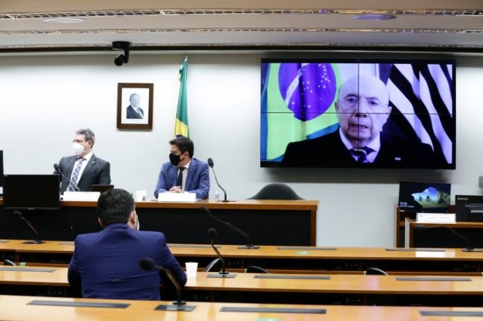 Meirelles (no telão) durante debate virtual no Cedes - (Foto: Najara Araujo/Câmara dos Deputados)